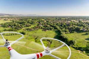 drone flying over prairie landscape